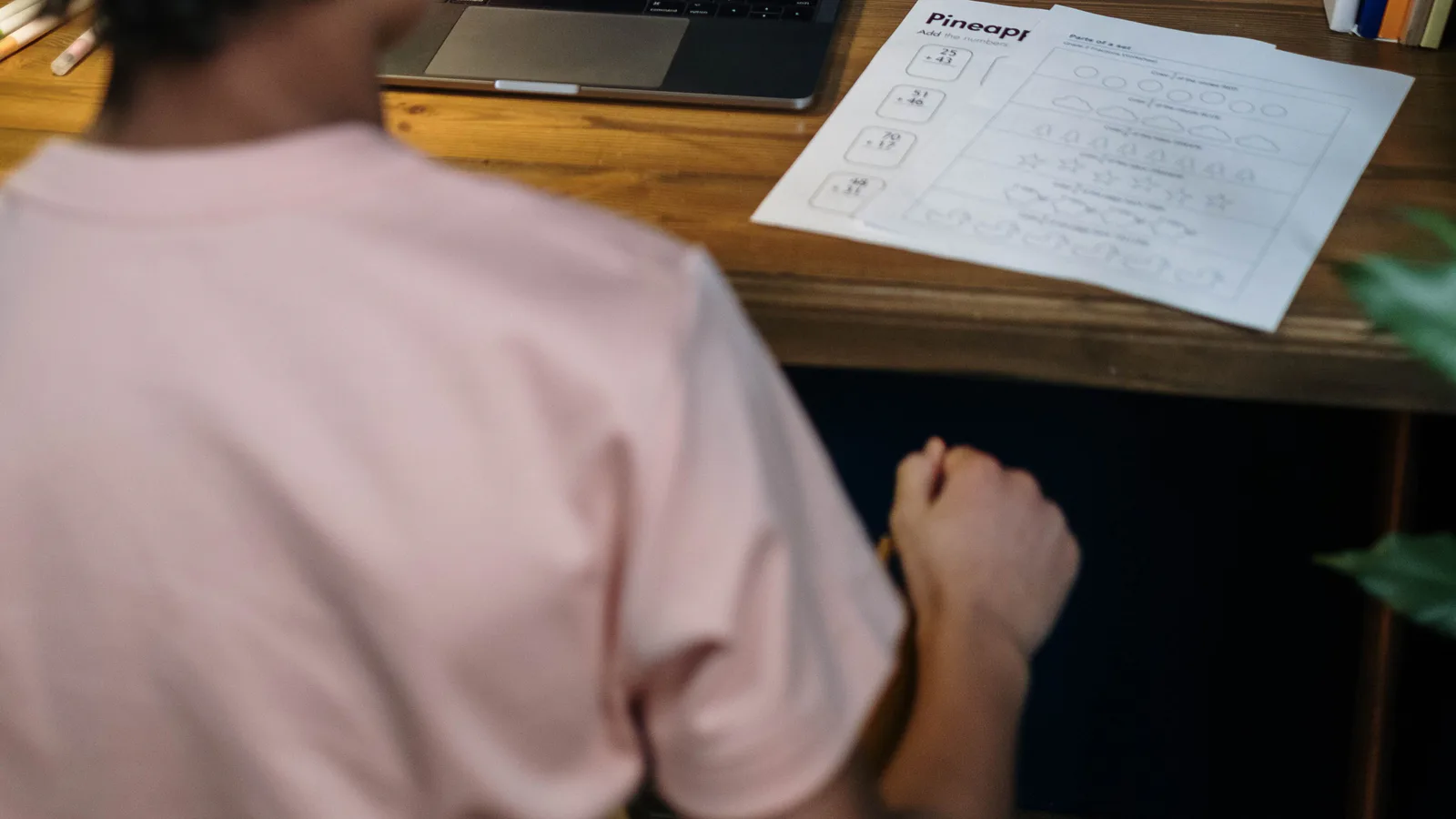 Student participating in an online lesson from a desk at home